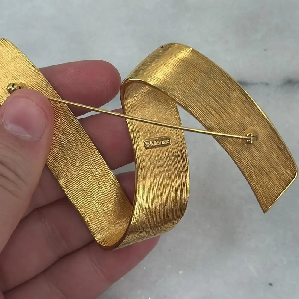 Vintage monet gold ribbon swoosh brooch